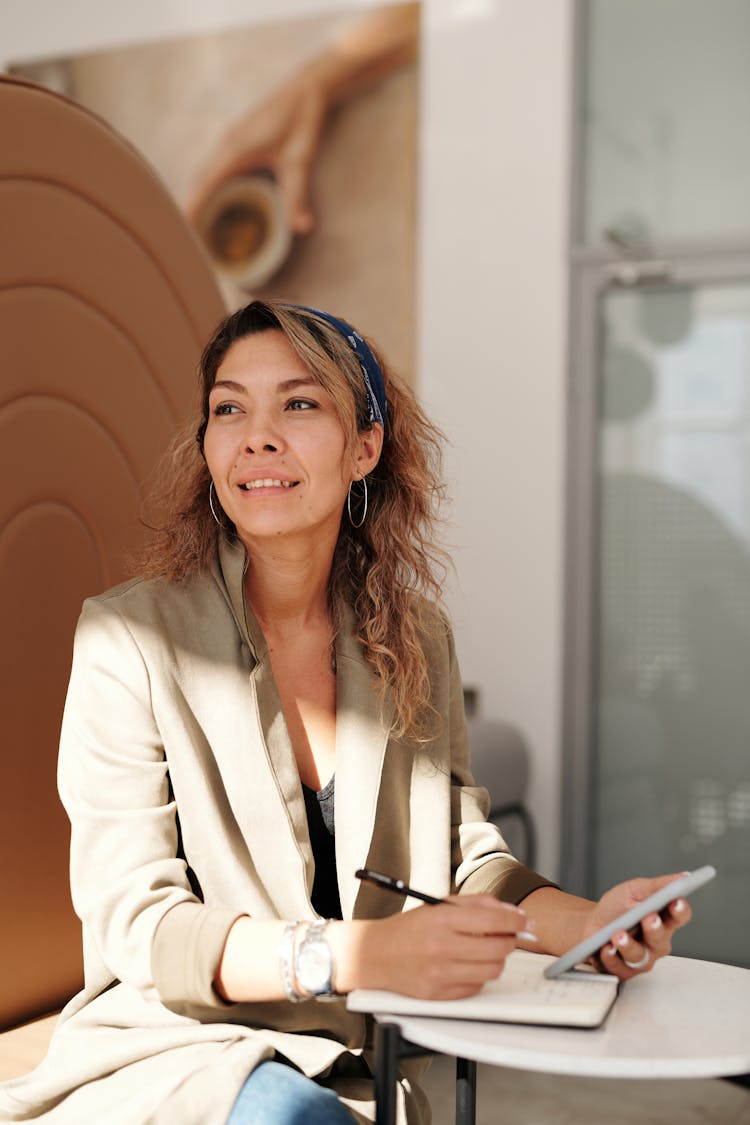 Woman In Brown Blazer Smiling