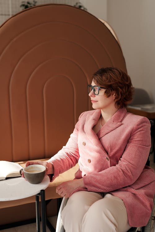 A Woman Holding Her Coffee 