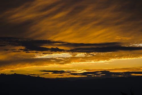 Silhouette of Cloudy Sky during Sunrise