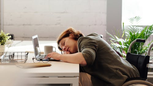 Free Woman Leaning on Her Table Stock Photo