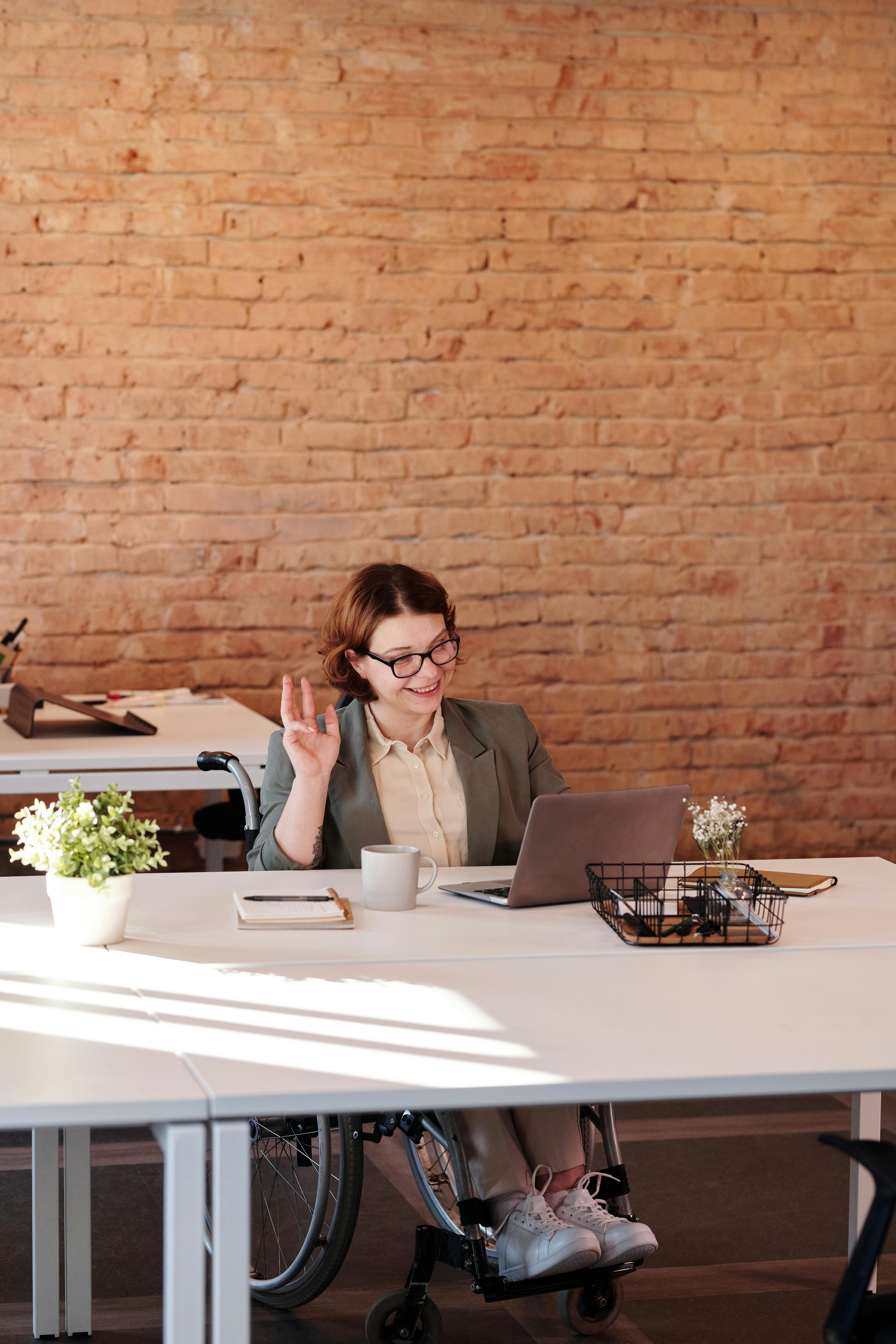 woman smiling while using laptop