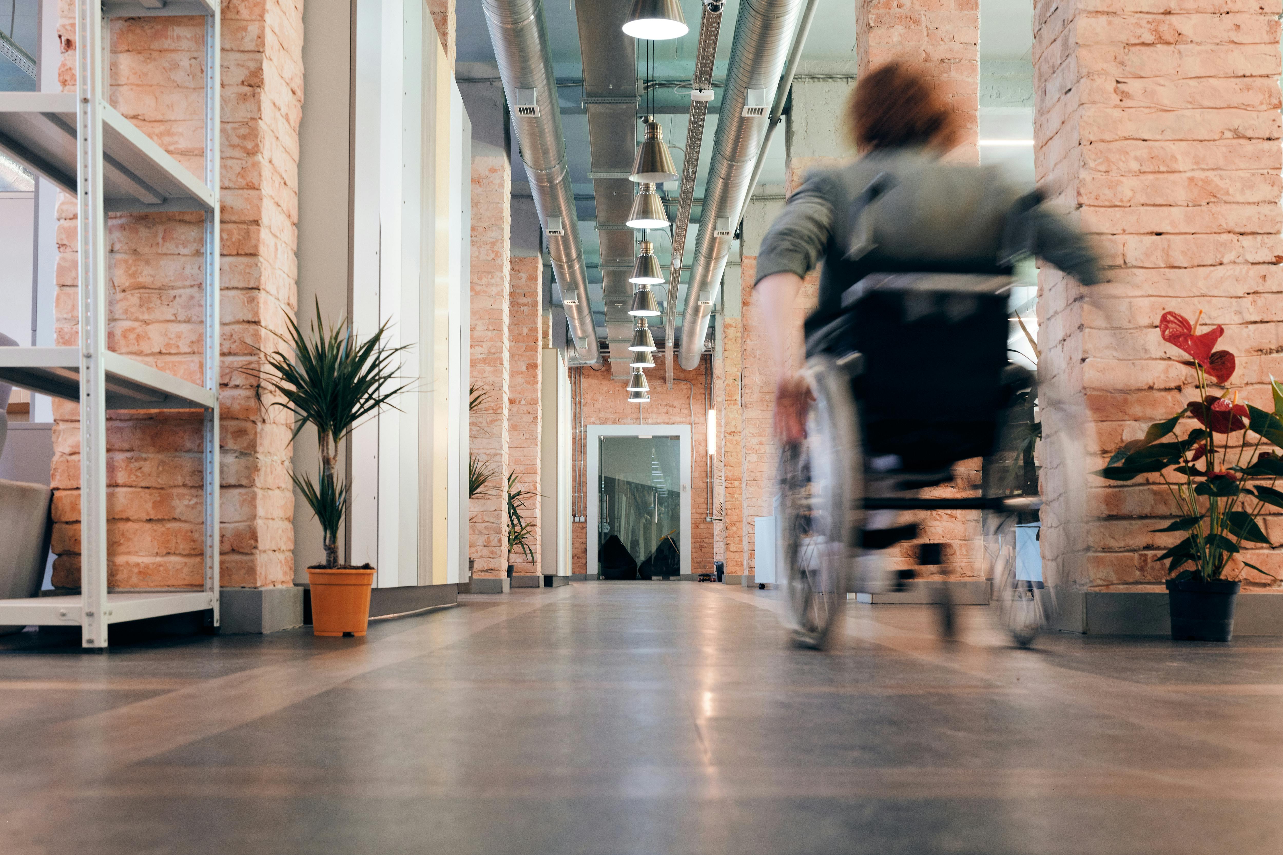 photo of woman moving her wheelchair