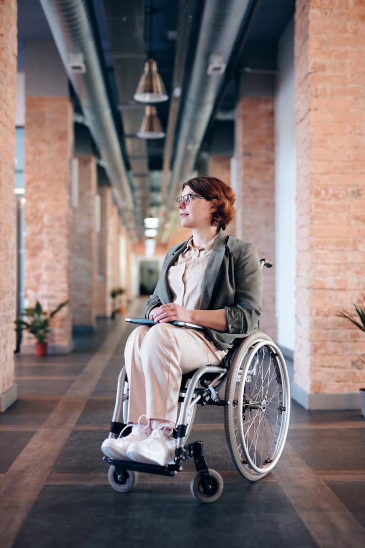 Woman Sitting On Wheelchair