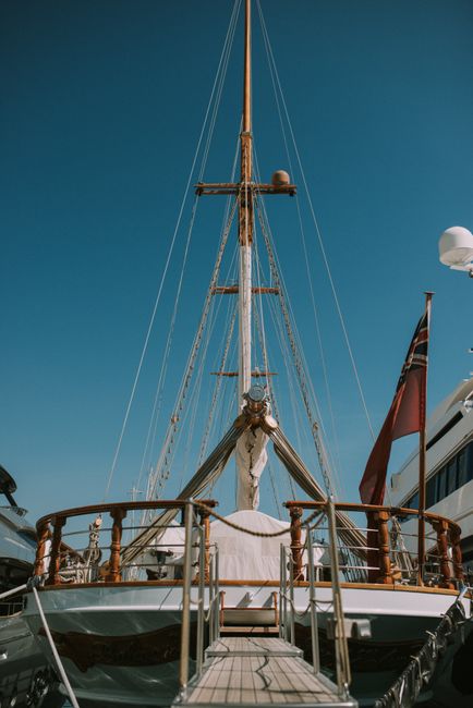 Elegant yacht deck with clear blue skies in Monte Carlo, showcasing luxury and maritime beauty.
