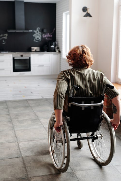 Free Woman Moving Using Wheelchair Stock Photo