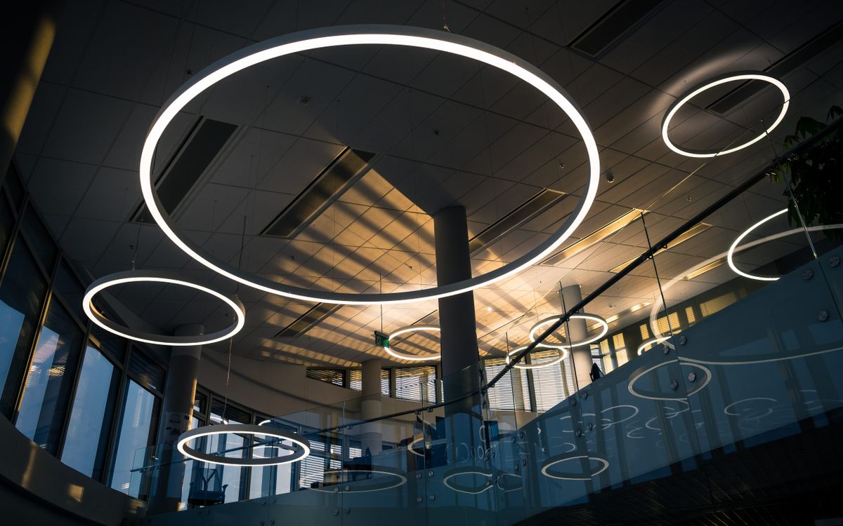 Modern architectural ceiling with integrated circular lighting fixtures