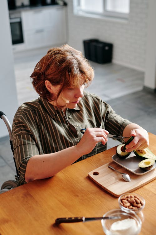 Woman Slicing an Avocado