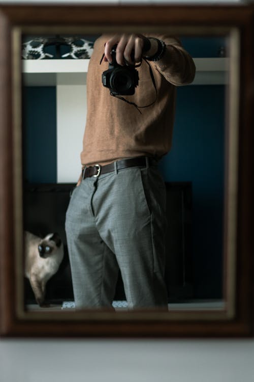 A Person Taking Photo in the Mirror