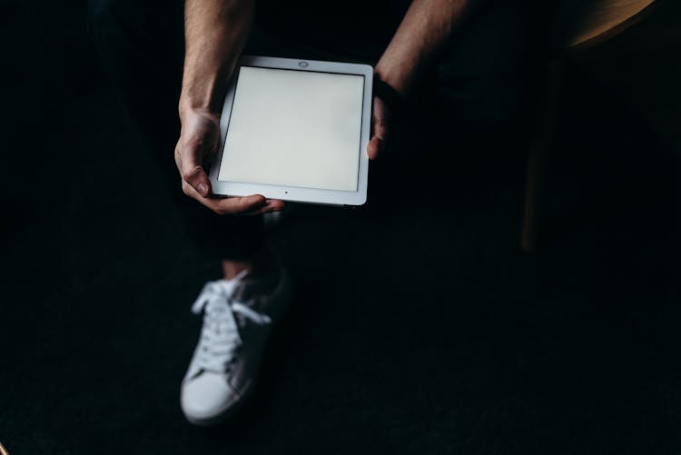 Person Holding White Tablet Computer