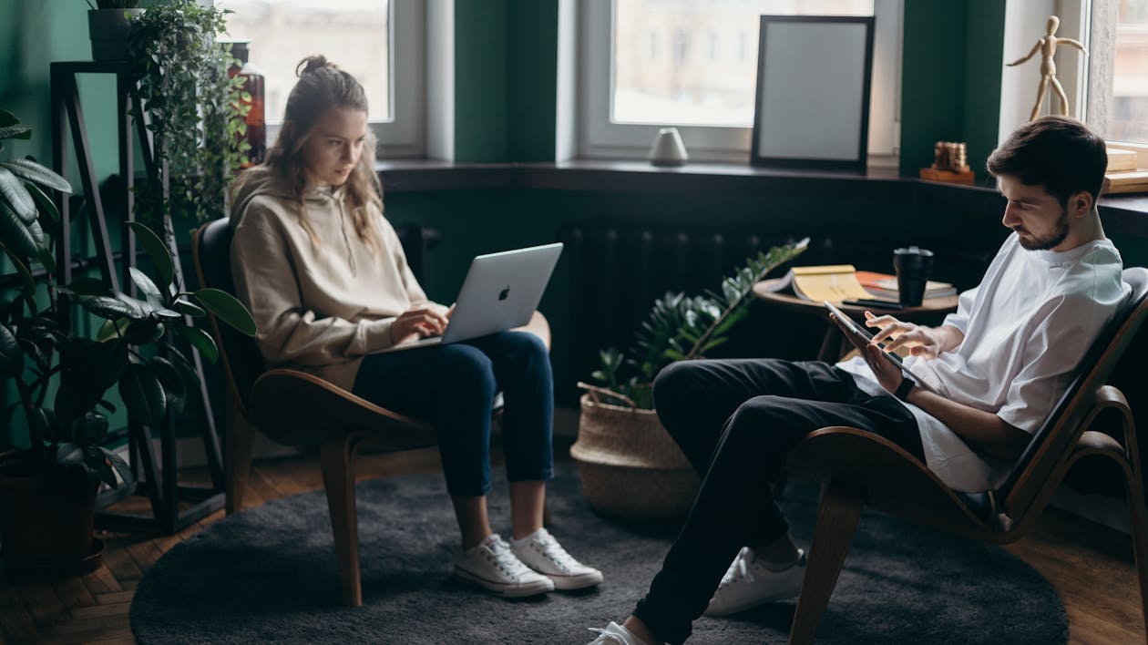 Free Photo of Two People Using Their Gadgets Stock Photo