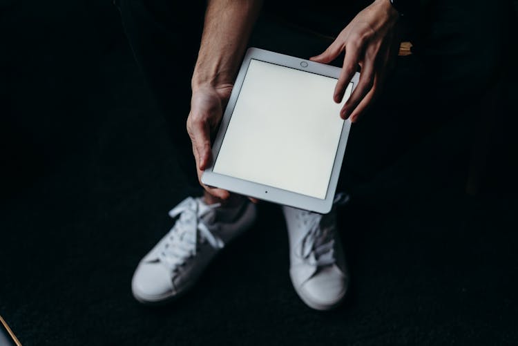 Person Holding White Tablet Computer