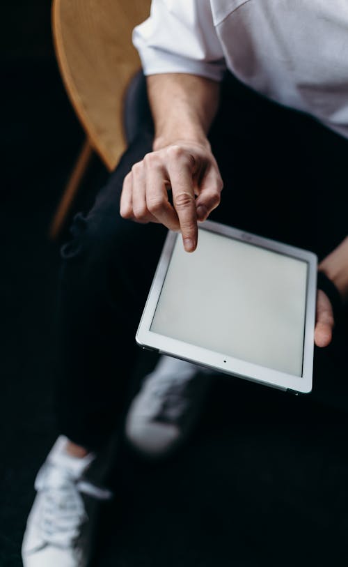 Person Holding White Tablet Computer