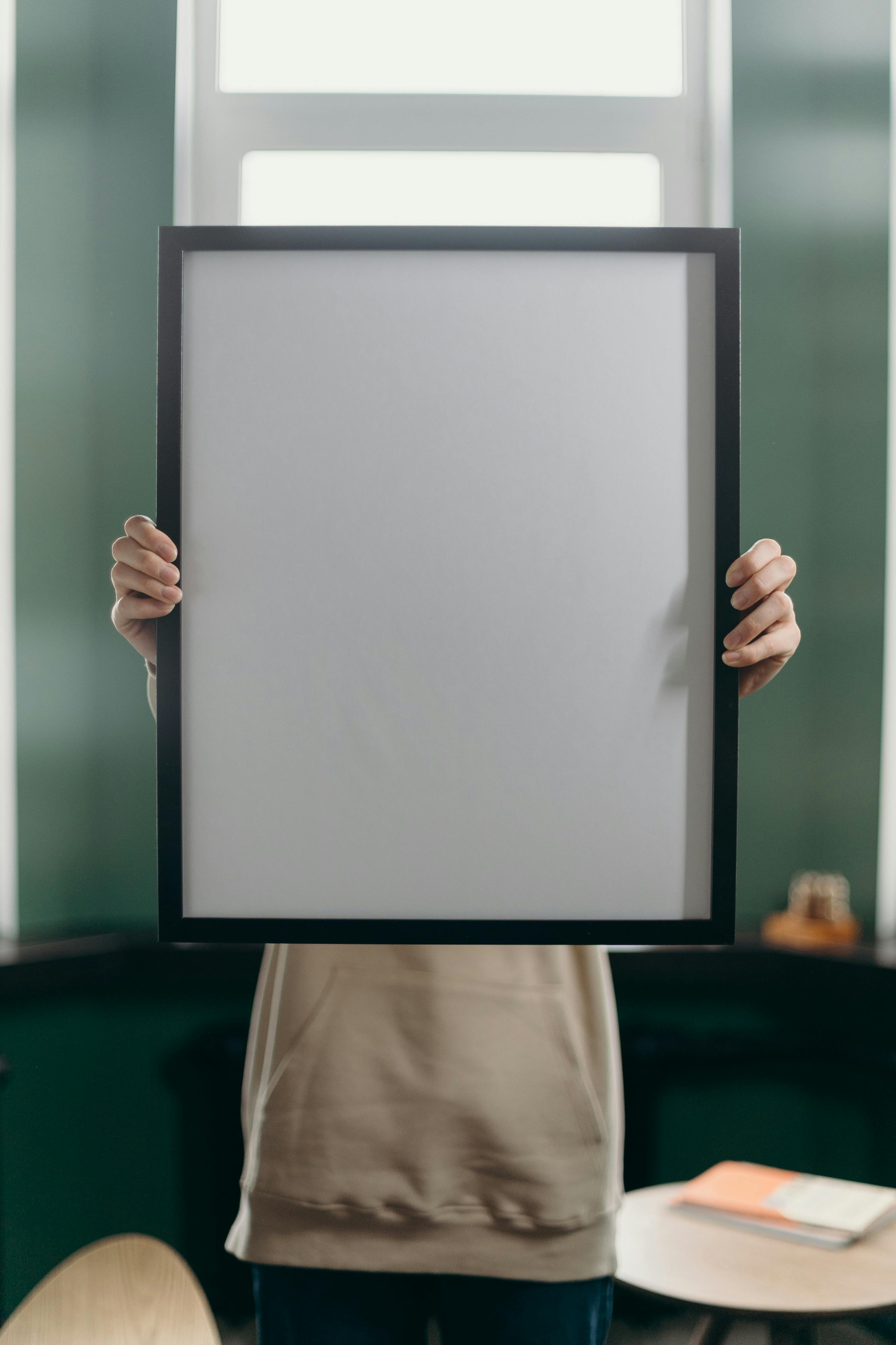 Person Holding White and Black Frame · Free Stock Photo