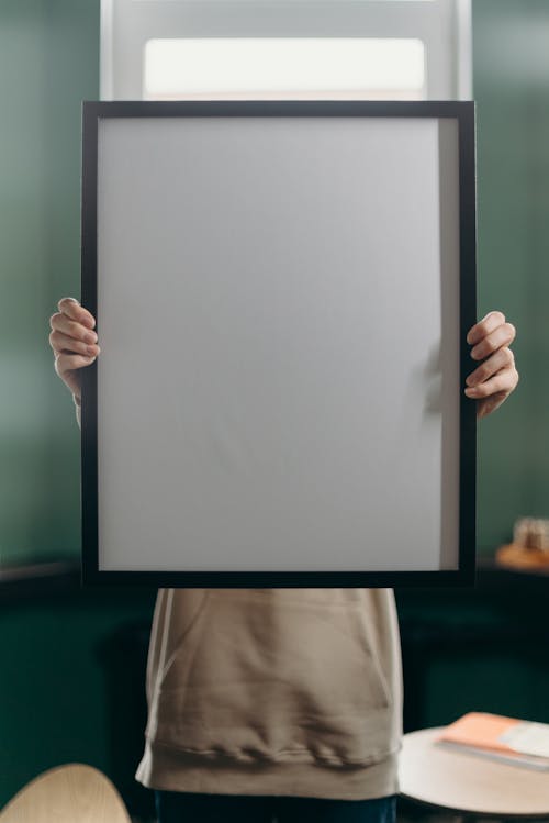 Free Person Holding White Printer Paper Stock Photo