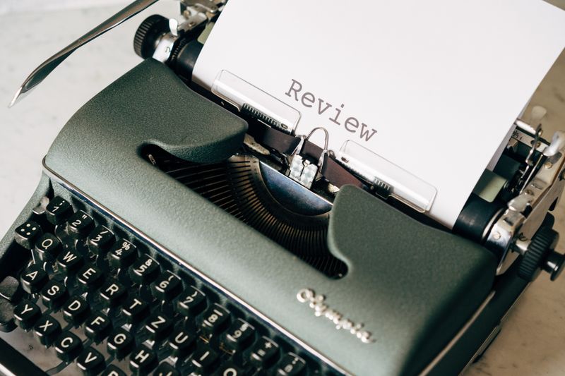 A typewriter loaded with blank paper, ready for a column