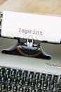 Black and White Typewriter With White Printer Paper
