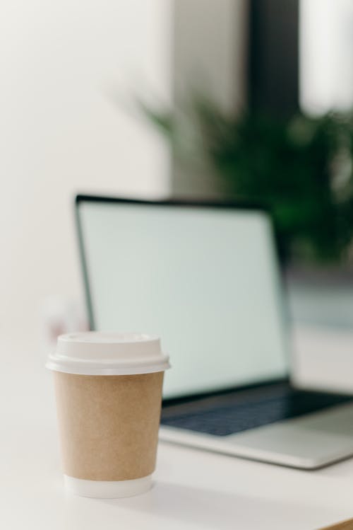 Free Brown and White Coffee Cup on White Table Stock Photo