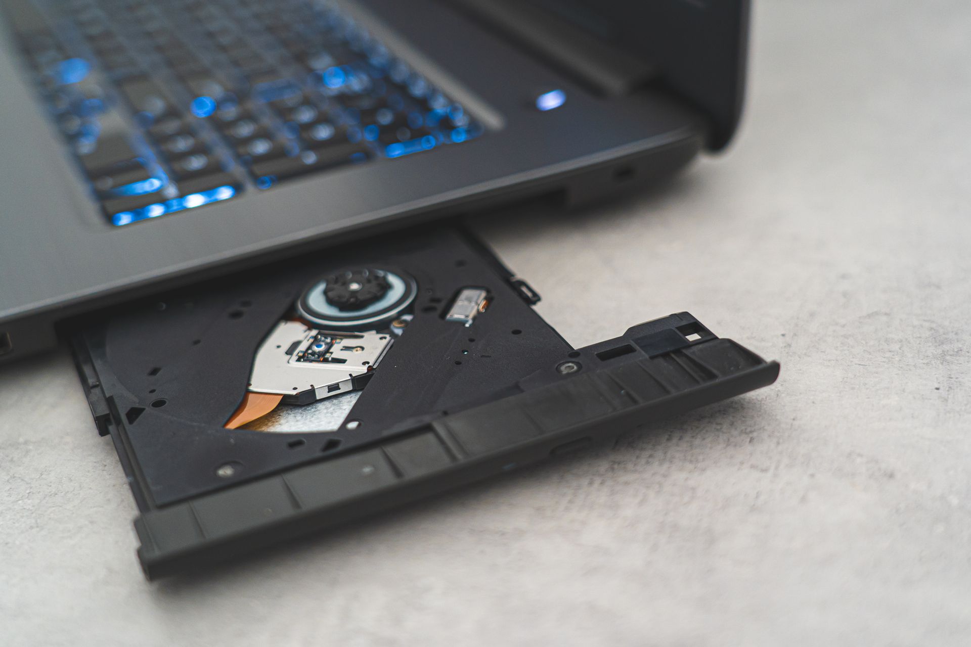 Black Laptop Computer on White Textile