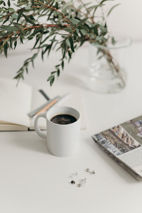 White Ceramic Mug on White Table