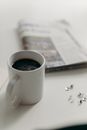 White Ceramic Mug on White Table