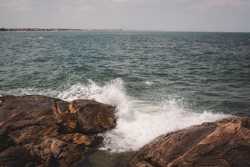 Photo Of Waves Crashing On Rocks