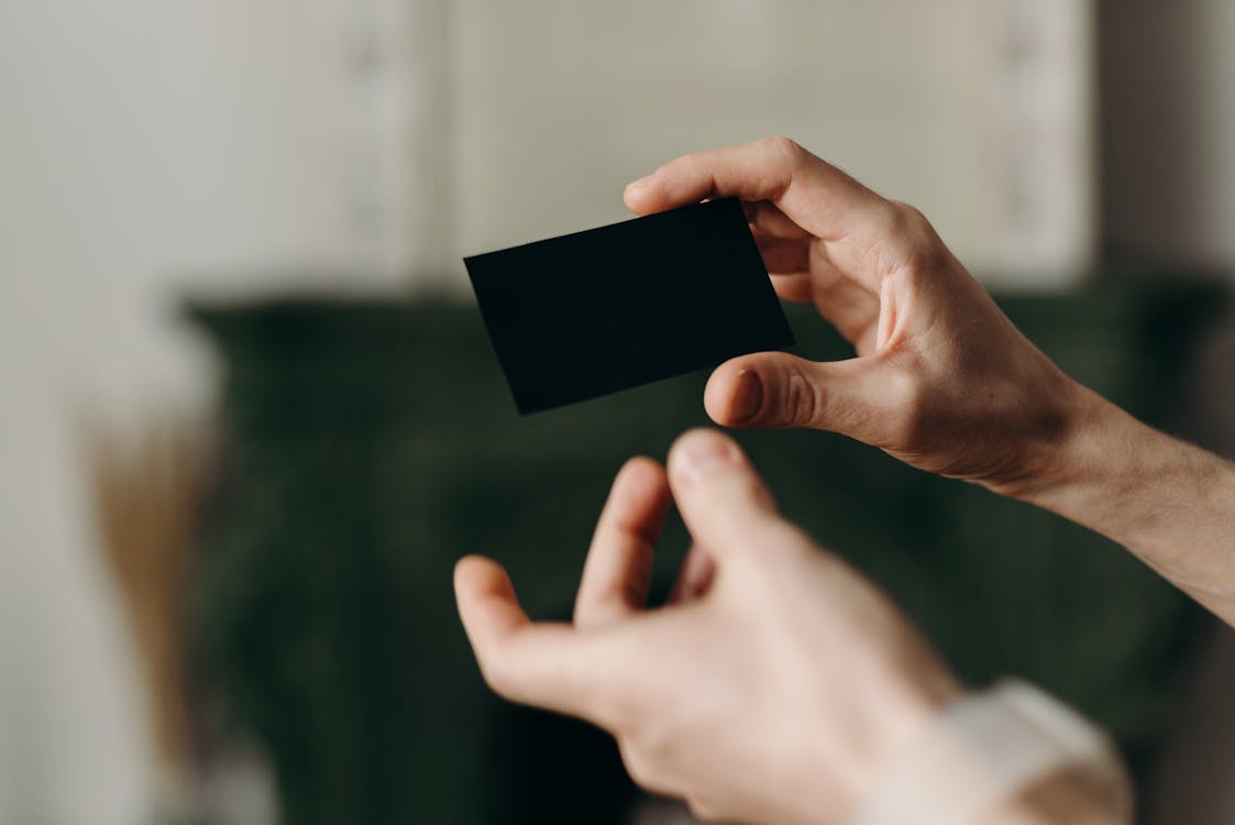 Free Person Holding Black Card Stock Photo