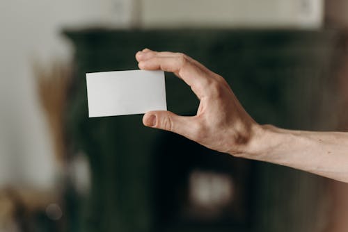 Free Person Holding White Blank Card Stock Photo