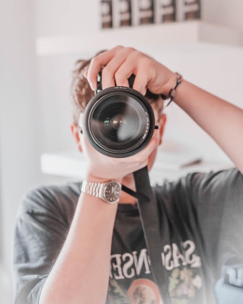 Photo of Person Taking Photo Using Black Camera