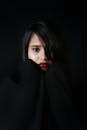 Woman Covering Her Face With Black Textile