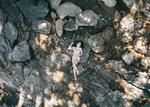 Free Photo Of Woman Laying On Top Of Rock  Stock Photo