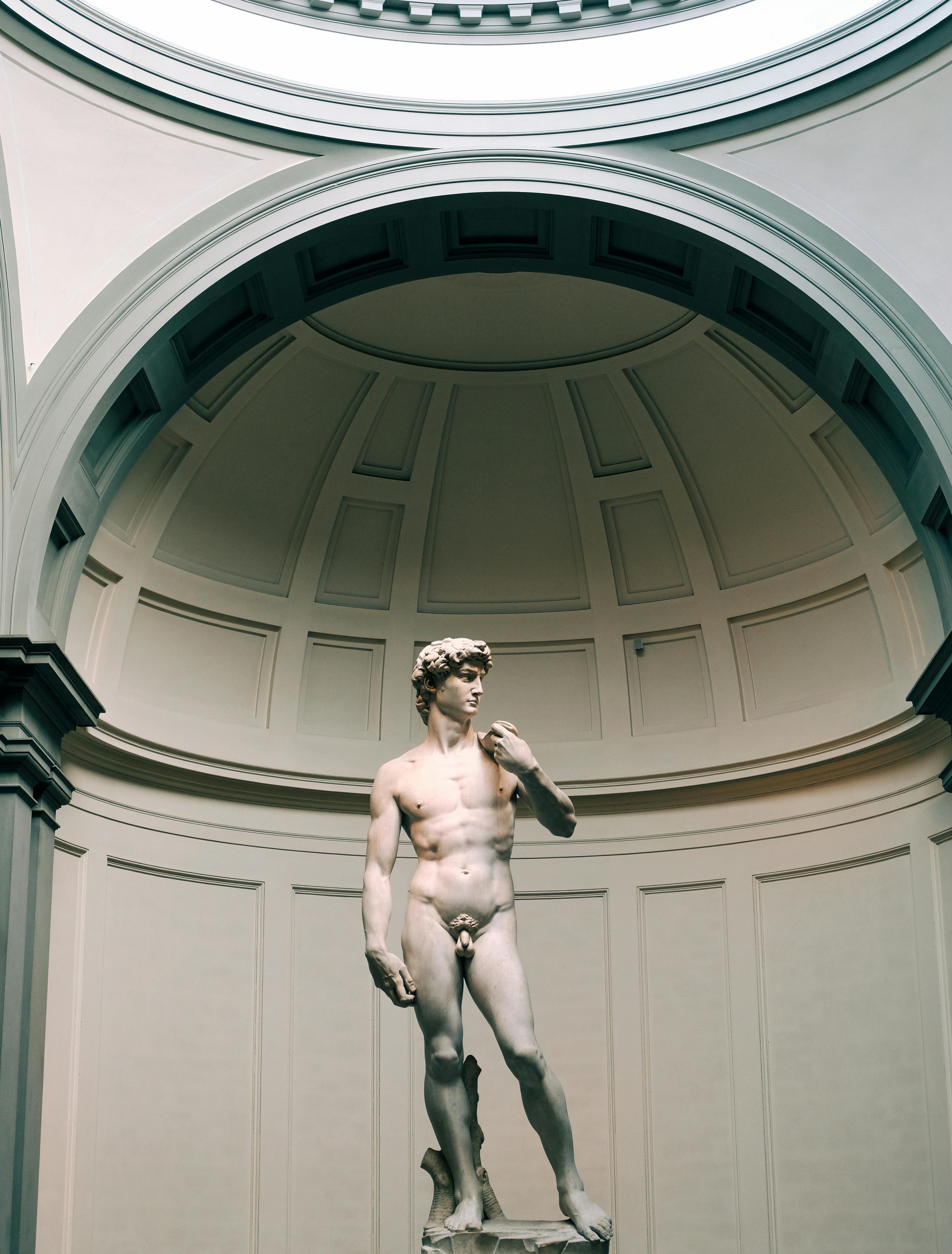 nude man statue inside building