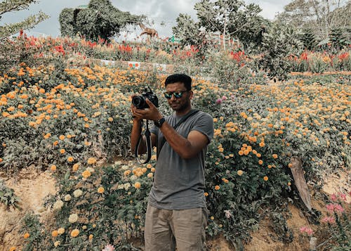 Photo of Man Taking Photo Using Digital Camera