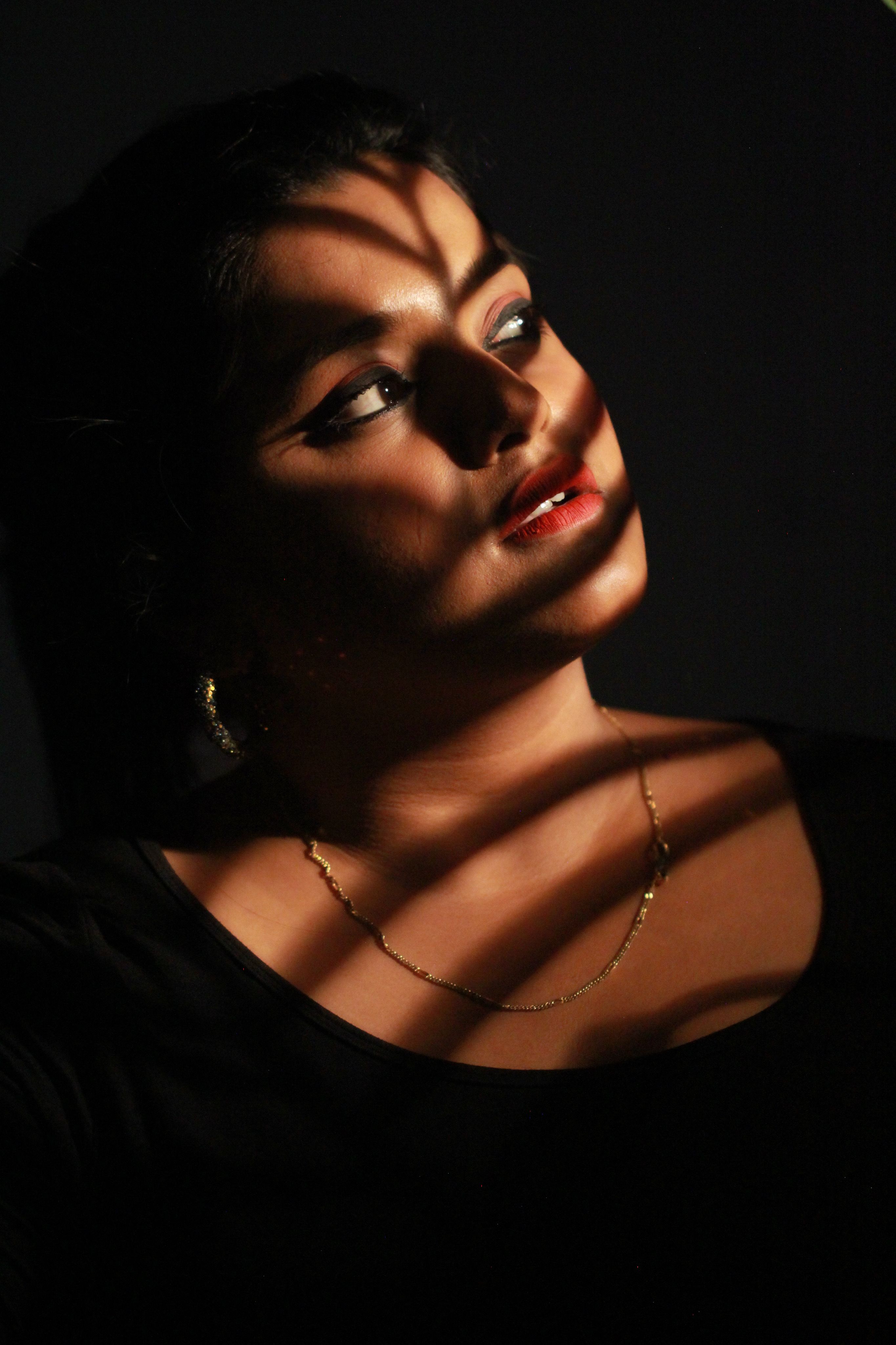 Close-Up Photo of Woman In Dark Room · Free Stock Photo
