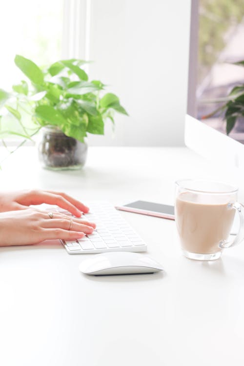 Person Using White Laptop Computer