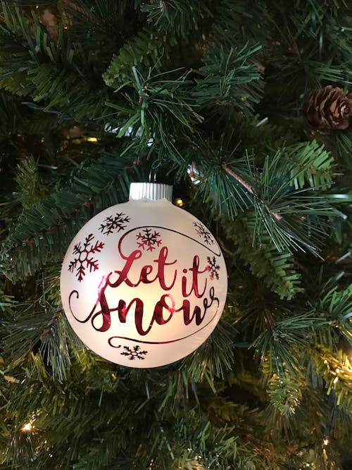 Close-Up Photo of Christmas Bauble Hanging on Christmas Tree
