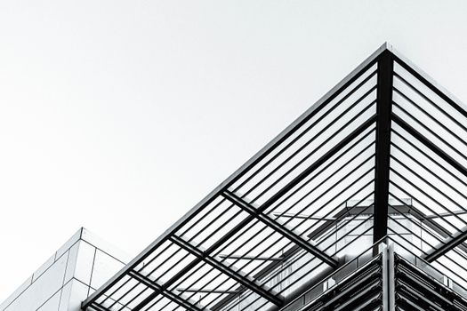Low angle shot of a modern building with steel and glass design in Port of Spain.
