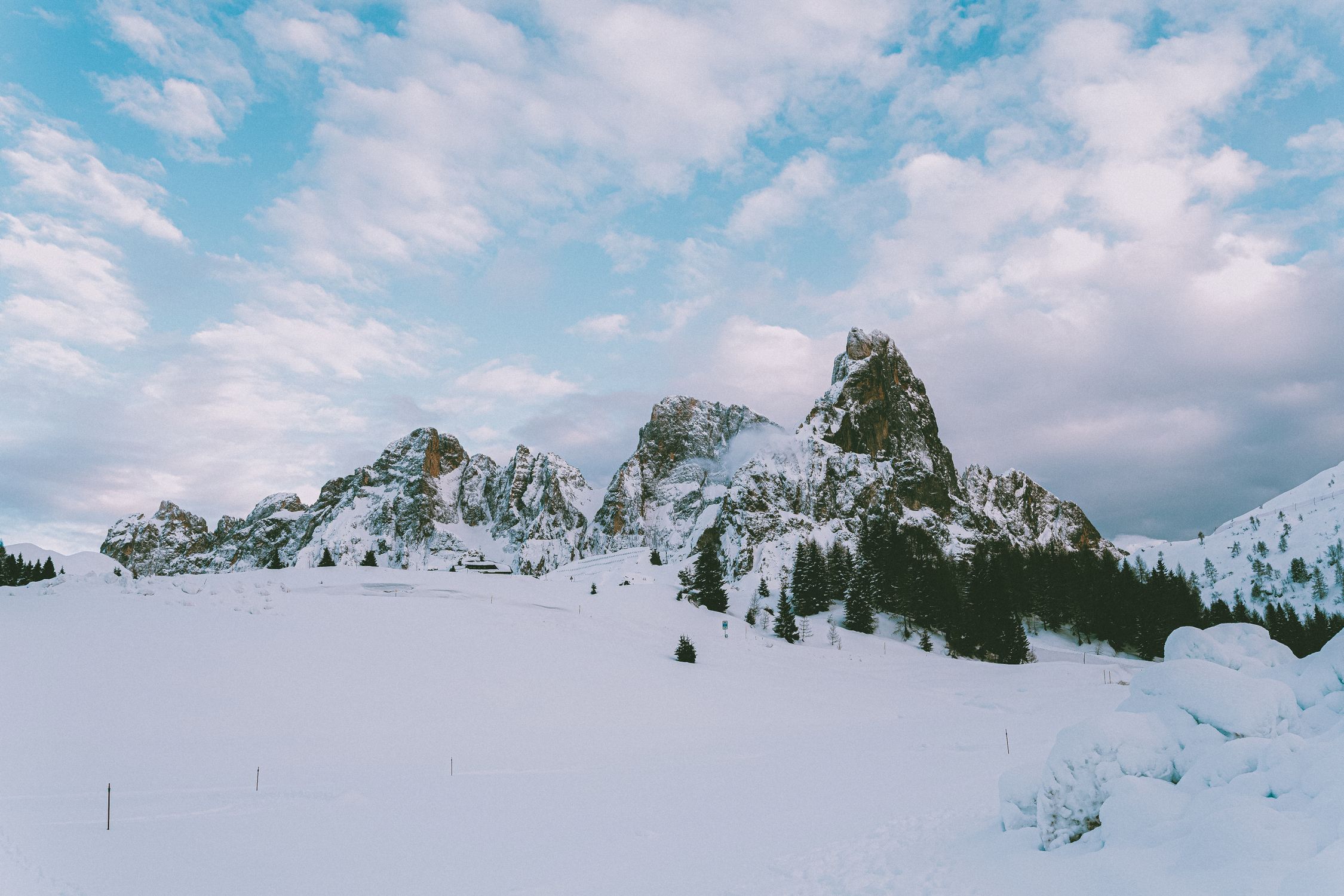Photo Of Snow Covered Mountains Under Cloudy Sky · Free Stock Photo