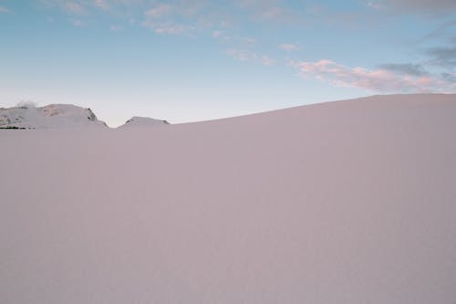 Photo Of Snow Covered Mountains During Dawn 