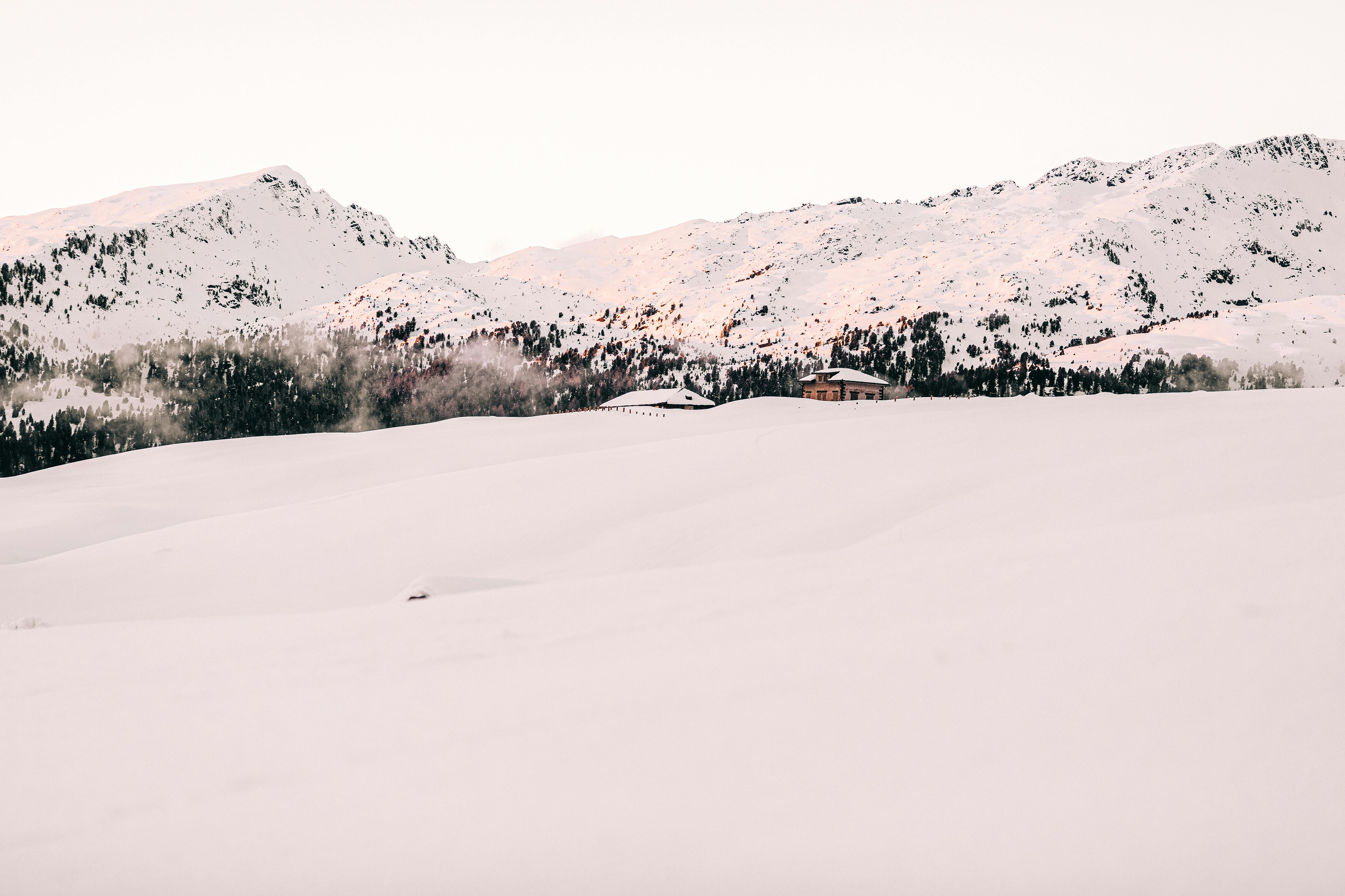 photo of snow covered mountain during daytime