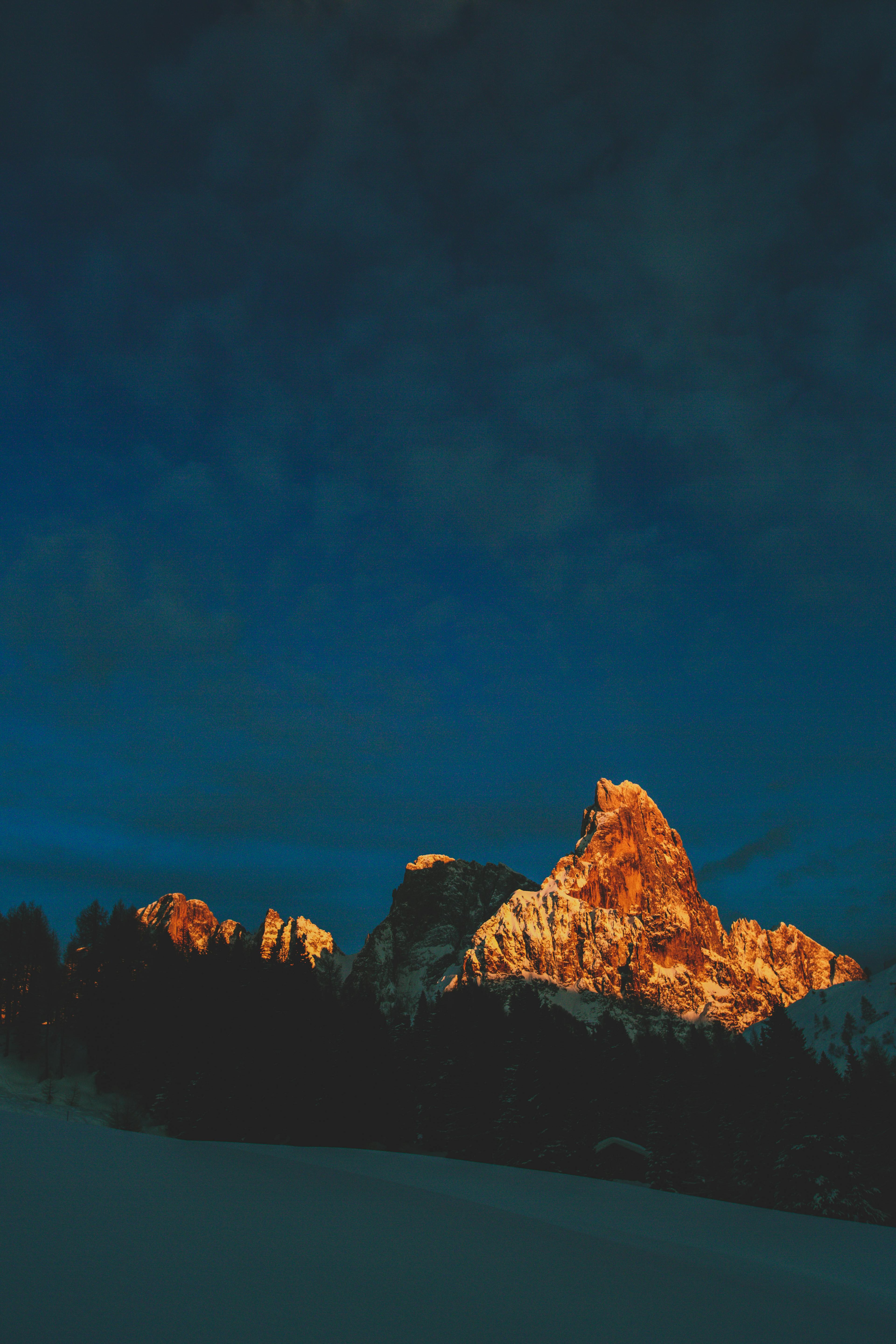 photo of rocky mountains during dawn