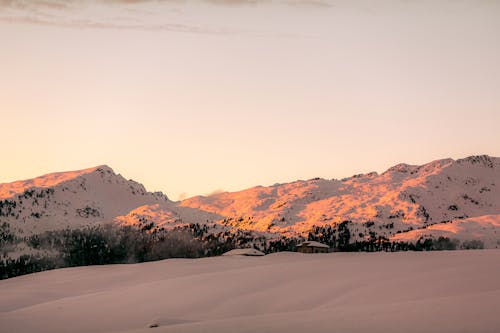 Photo Of Snow Capped Mountains During Dawn 