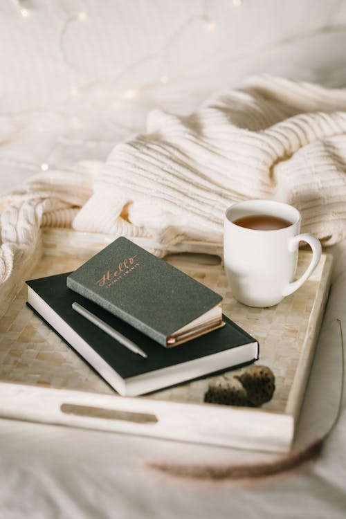 Free Photo Of Cup Beside Books Stock Photo