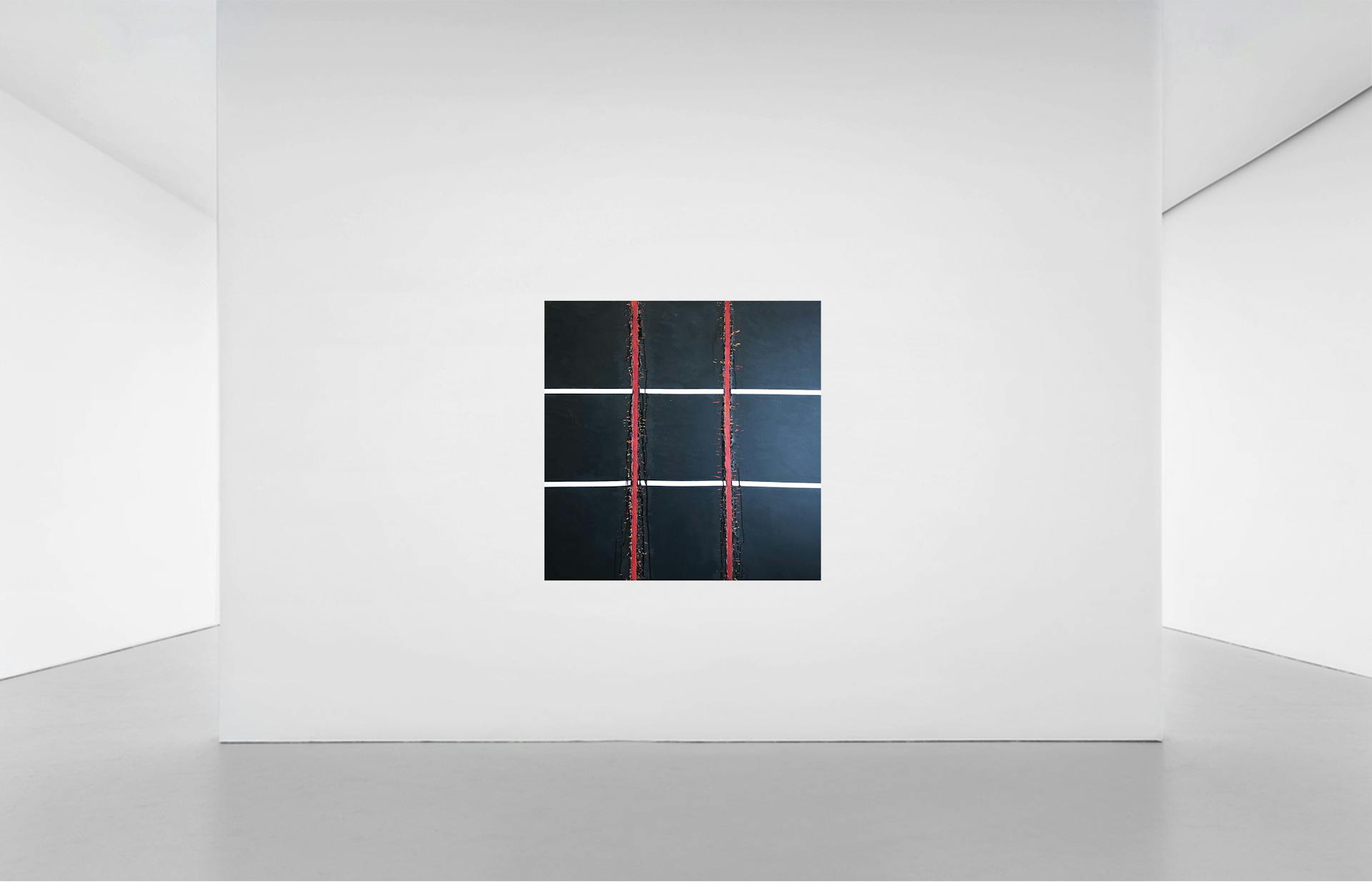 A minimalist art piece displayed in an empty gallery room with a focus on simplicity and space.