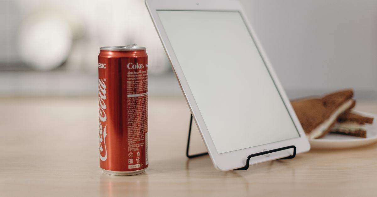 Coca Cola Computer White Tablet Computer Beside Red Coca Cola Can · Free Stock Photo