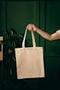 Person Holding White Tote Bag