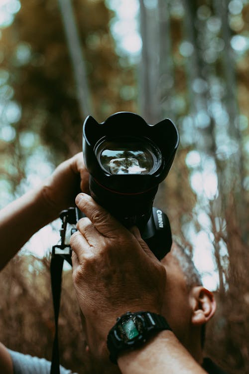 Photo Of Person Holding Black Camera