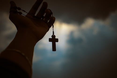 Free Person Holding Brown Wooden Cross Stock Photo