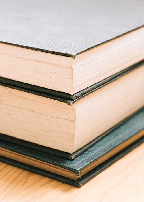 Close-Up Photo of Stack of Hardbound Books