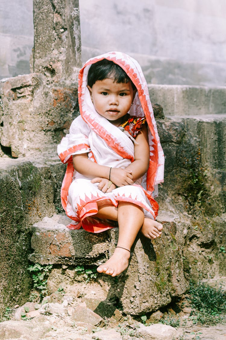 Photo Of Child Sitting On Stairs