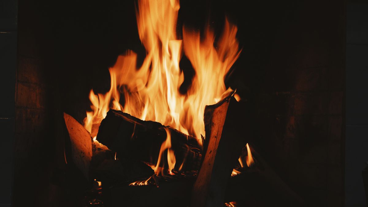 Photo: Vladislav Shurgin / Pexels Close-up of flames burning in a dark fireplace